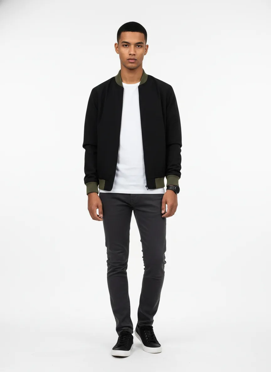 Cinema Outfit Idea: Man’s black bomber jacket with olive accents