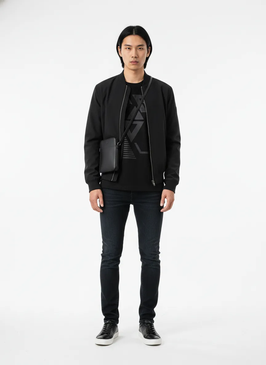 Concert Outfit Idea: Mans black graphic tee with charcoal accents